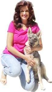 <p>Suzana Gartner with a German Shepard, a formerly homeless animal</p>
